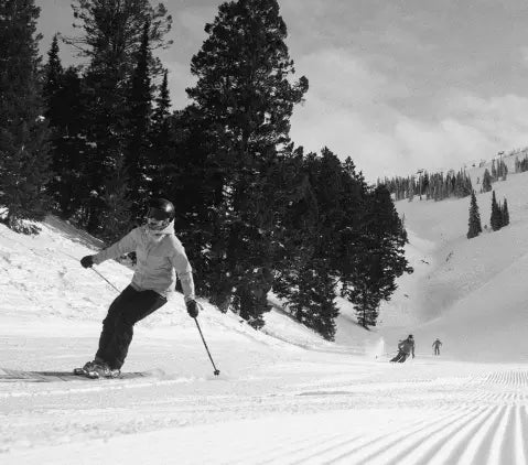 Skiers getting fresh groomer laps